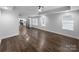 Open-concept living room showcasing the hardwood floors and natural light at 118 W Lee Ave, Bessemer City, NC 28016