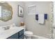 Cozy bathroom with updated vanity, decorative mirror, and neutral wall color at 121 Inlet Point Dr, Tega Cay, SC 29708