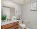 Bright bathroom with a vanity, decorative mirror, and neutral wall color at 121 Inlet Point Dr, Tega Cay, SC 29708