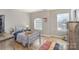 Comfortable bedroom with wood-look flooring, natural light, and playful decor at 121 Inlet Point Dr, Tega Cay, SC 29708