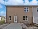 Rear exterior with a patio and a grassy yard at 121 Woodbridge Cir, Mount Holly, NC 28120