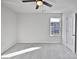 Cozy bedroom featuring neutral carpet, a ceiling fan, and a bright window at 121 Woodbridge Cir, Mount Holly, NC 28120