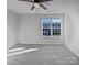 Bright bedroom with carpet flooring and natural light at 121 Woodbridge Cir, Mount Holly, NC 28120