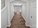 Hallway with hardwood floors leading to a spacious living area at 121 Woodbridge Cir, Mount Holly, NC 28120