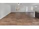 Spacious living room with hardwood floors, a ceiling fan, and natural light at 121 Woodbridge Cir, Mount Holly, NC 28120