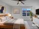 Cozy bedroom with soft carpet, neutral tones, and a ceiling fan at 121 Woodbridge Cir, Mount Holly, NC 28120