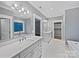 Large bathroom featuring double sinks, ample counter space, and a separate bathtub at 1210 Aragon Beach Rd, Rock Hill, SC 29732