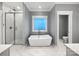 Modern bathroom with a soaking tub and glass shower enclosure at 1210 Aragon Beach Rd, Rock Hill, SC 29732