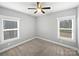 Neutral bedroom with two windows and carpeted floors at 1210 Aragon Beach Rd, Rock Hill, SC 29732