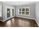 Dining room with hardwood floors, modern chandelier and natural light at 1210 Aragon Beach Rd, Rock Hill, SC 29732