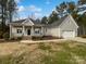 Charming one-story home with a gray exterior, a well-kept lawn, and a two-car garage at 1210 Aragon Beach Rd, Rock Hill, SC 29732