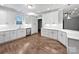 Modern kitchen featuring white cabinets, quartz countertops, stainless steel appliances, and hardwood floors at 1210 Aragon Beach Rd, Rock Hill, SC 29732