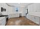 Modern kitchen with white cabinets, stainless steel appliances, and hardwood floors at 1210 Aragon Beach Rd, Rock Hill, SC 29732