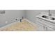 Functional laundry room with a wash basin and a gray painted wall at 1210 Aragon Beach Rd, Rock Hill, SC 29732