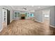 Spacious living room with a cozy fireplace and lots of natural light, with hardwood floors and neutral paint at 1210 Aragon Beach Rd, Rock Hill, SC 29732
