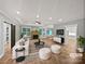 Bright, open living room with fireplace, ceiling fan, recessed lighting, and access to kitchen, with modern decor at 1210 Aragon Beach Rd, Rock Hill, SC 29732