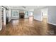Open-concept living room features a fireplace, hardwood floors, and abundant natural light at 1210 Aragon Beach Rd, Rock Hill, SC 29732