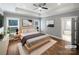 Serene bedroom featuring tray ceilings, hardwood floors, two windows and neutral decor at 1210 Aragon Beach Rd, Rock Hill, SC 29732