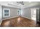 Bright, serene primary bedroom with hardwood floors and tray ceilings, filled with natural light at 1210 Aragon Beach Rd, Rock Hill, SC 29732