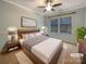 Cozy bedroom with modern furniture, plush bedding, and a large window for natural light at 13217 Reunion St, Charlotte, NC 28278