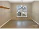 Neutral colored room, ceramic tile floors, and a large window that allows natural light at 13217 Reunion St, Charlotte, NC 28278