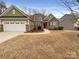 Charming single-Gathering home with a well-manicured front yard and inviting curb appeal at 13217 Reunion St, Charlotte, NC 28278