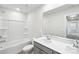 A bright bathroom features a shower/tub combo, modern vanity, and tile floors at 138 Aberdeen Dr, Salisbury, NC 28144