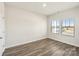 A modern bedroom showcases wood floors, two windows, fresh paint and great natural light at 138 Aberdeen Dr, Salisbury, NC 28144