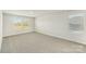 A spacious bedroom features neutral carpet, a large window, and fresh paint at 138 Aberdeen Dr, Salisbury, NC 28144