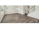Bright living room featuring modern flooring, neutral walls, and staircase access at 138 Aberdeen Dr, Salisbury, NC 28144