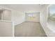Spacious loft featuring plush carpeting, natural light, and neutral walls at 138 Aberdeen Dr, Salisbury, NC 28144