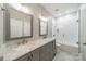 Modern bathroom with gray double vanity, marble countertop, large mirrors, and a tiled shower at 143 Shoreview Dr # 7, Mooresville, NC 28117