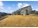 Exterior view of the home with a screened-in porch and a spacious yard at 144 Tetcott St, Mooresville, NC 28115