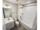Well-lit full bathroom featuring a shower-tub combo and a vanity with storage at 144 Tetcott St, Mooresville, NC 28115