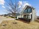 Beautiful two-story home featuring stone accents, a well-maintained lawn, and mature landscaping at 144 Tetcott St, Mooresville, NC 28115