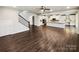 Spacious open-concept living space with hardwood floors and staircase at 144 Tetcott St, Mooresville, NC 28115