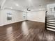 Spacious living room featuring hardwood floors, recessed lights, and a ceiling fan at 144 Tetcott St, Mooresville, NC 28115