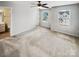 Bright main bedroom with plush carpeting and large windows offering plenty of natural light at 144 Tetcott St, Mooresville, NC 28115