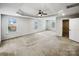 A spacious main bedroom with a tray ceiling, ceiling fan, and ample natural light from multiple windows at 144 Tetcott St, Mooresville, NC 28115