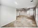 A spacious main bedroom with a tray ceiling, ceiling fan, and views of the walk-in closet at 144 Tetcott St, Mooresville, NC 28115