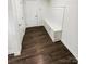 Mud room featuring built-in bench with storage and hardwood flooring at 144 Tetcott St, Mooresville, NC 28115