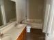 Bathroom featuring double sinks, toilet, and bathtub at 15200 Chowning Tavern Ln, Charlotte, NC 28262
