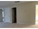 Carpeted bedroom featuring multiple doorways and natural light at 15200 Chowning Tavern Ln, Charlotte, NC 28262