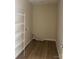 Functional laundry room with wire shelving, ventilation, and neutral-colored walls at 15200 Chowning Tavern Ln, Charlotte, NC 28262