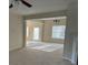 Open living room with carpeted floors at 15200 Chowning Tavern Ln, Charlotte, NC 28262
