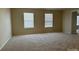 Carpeted living room with abundant natural light streaming through the windows at 15200 Chowning Tavern Ln, Charlotte, NC 28262