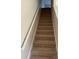Carpeted staircase with white railing leading to the upper floor at 15200 Chowning Tavern Ln, Charlotte, NC 28262