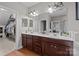 Bathroom featuring a double sink vanity, a large mirror, and a walk-in closet at 15323 Prescott Hill Ave, Charlotte, NC 28277