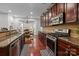 Kitchen with stainless steel appliances, granite counters, and eat-in breakfast nook at 15323 Prescott Hill Ave, Charlotte, NC 28277