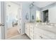 Well-lit bathroom featuring a double sink vanity, and modern fixtures at 16110 Foreleigh Rd, Huntersville, NC 28078